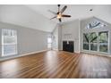 Bright living room featuring fireplace, vaulted ceiling, and lots of windows at 2500 Cranbrook Ln # 5, Charlotte, NC 28207