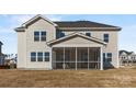 The backyard features a screened porch and a view of the neighborhood at 304 Balboa St, Matthews, NC 28104