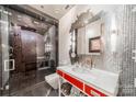 A modern bathroom featuring mosaic tile work in the shower and a stylish red vanity at 310 Arlington Ave # Multiple, Charlotte, NC 28203
