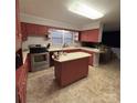 A kitchen with a center island, stainless steel oven, and updated appliances at 3367 Marshall Wolfe Rd, Kings Mountain, NC 28086
