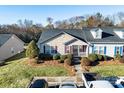 Charming home with landscaped front yard, sidewalk, and ample parking at 450 Guiness Pl, Rock Hill, SC 29730