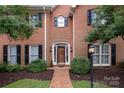 Charming two-story brick home featuring a classic design, well-maintained landscaping, and a welcoming front entrance at 4605 Curraghmore Rd, Charlotte, NC 28210