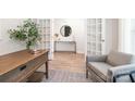 Bright office space with neutral decor, wooden desk, and comfortable seating area at 5050 Beargrass Dr, Dallas, NC 28034