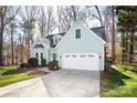 Charming home with a well-manicured lawn, attached garage, and inviting entryway at 7007 Chapparall Ln, Charlotte, NC 28215