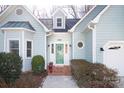 Charming home featuring a decorative front door and a brick-lined entryway at 7007 Chapparall Ln, Charlotte, NC 28215