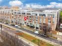 Street view of the condo building at 710 W Trade St #314 showing parking area at 710 W Trade St # 314, Charlotte, NC 28202