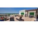 Inviting roof deck with lounge seating, ideal for entertaining guests at 718 W Trade St # 302, Charlotte, NC 28202