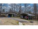 Detached garage and metal carport on a spacious rural property at 9257 Mull Rd, Vale, NC 28168