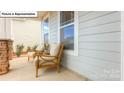 Inviting front porch with comfortable seating, perfect for enjoying the outdoors at 153 Saidin Ln, Troutman, NC 28166