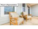 Cozy front porch with seating, offering a relaxing outdoor space at 153 Saidin Ln, Troutman, NC 28166