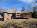 A large, private backyard featuring a deck and brick exterior at 167 Patterson Rd, Kings Mountain, NC 28086