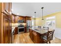 Modern kitchen featuring stainless steel appliances, an island, and granite countertops at 1701 Montclair Ave, Gastonia, NC 28054