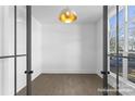 Home office with hardwood floors, natural light, and modern French doors at 2019 Mandarin Blvd, Charlotte, NC 28205