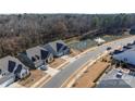 Beautiful aerial view of homes in a community with pond and fountain feature at 234 Pintail Dr, Monroe, NC 28110