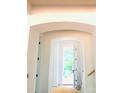 Entryway with arched doorway and white trim provides natural light in this newly built home at 2530 Elkwood Cir, Charlotte, NC 28205