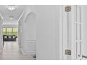 Bright hallway with white walls, arched doorways, and modern lighting fixtures at 3008 Dundee Ln, Fort Mill, SC 29707
