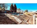 Backyard featuring an in-ground pool, a weathered deck, and a partially fenced yard at 742 Aquadale Rd, Albemarle, NC 28001