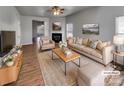 Bright living room with a fireplace, neutral colors, and modern decor at 8353 Ainsworth St, Charlotte, NC 28216