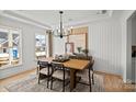 Dining room featuring a wood table with seating for six and modern chandelier at 1056 Kinship Dr # 113, Lancaster, SC 29720