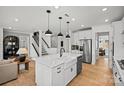 Open-concept kitchen with large island, stainless steel appliances, and a farmhouse sink at 1056 Kinship Dr # 113, Lancaster, SC 29720