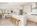 Bright, modern kitchen with white cabinets, stainless appliances, and a large island with bar seating at 1614 Shoals Ave # 151, Belmont, NC 28012
