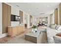 Bright living room with modern decor, a large sectional sofa, and an entertainment center at 1615 Shoals Ave # 158, Belmont, NC 28012