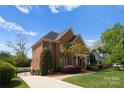 Beautiful brick home with a well-maintained lawn and inviting curb appeal at 1754 Sterling Rd, Charlotte, NC 28209