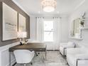 This home office features a large window, modern light fixture, and neutral-colored decor at 1914 Sparkling Stream Dr # 057, Belmont, NC 28012