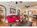 Cozy living room featuring hardwood floors, archways, and an elegant mirror at 204 Sylvania Ave, Charlotte, NC 28206