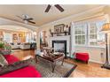 Bright living room with hardwood floors, fireplace, and arched doorways at 204 Sylvania Ave, Charlotte, NC 28206