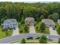 An aerial view showcases this lovely home nestled within a lush, tree-filled neighborhood at 2108 Clarion Dr, Fort Mill, SC 29707