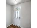 The interior entrance door of the home with light gray walls and dark wood flooring at 2280 Hedgecliff Rd, Kannapolis, NC 28025