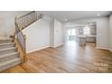 Open-concept living room featuring hardwood floors, stairs and natural light at 2300 Hedgecliff Rd # 160, Kannapolis, NC 28025