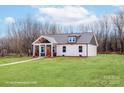 Charming craftsman-style home with a welcoming front porch and well-maintained lawn at 2853 W Zion Church Rd, Shelby, NC 28150