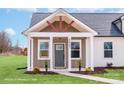 The home's inviting porch is framed by elegant columns and windows, and has the house number above the door at 2867 W Zion Church Rd, Shelby, NC 28150