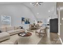 Bright, open-concept living room with modern finishes and seamlessly connected dining and kitchen areas at 2867 W Zion Church Rd, Shelby, NC 28150