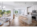 Bright, open kitchen featuring stainless steel appliances, center island with bar seating, and an eat-in breakfast nook at 3158 Finchborough Ct # 256, Charlotte, NC 28269