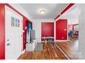 Bright entryway featuring wood flooring and a glass-paneled door at 41 Fleetwood Sw Dr # 44, Concord, NC 28027