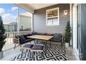 Cozy back porch with outdoor seating and patterned rug at 416 Clemson Tree Ln, Lake Wylie, SC 29710