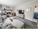 Cozy living room with fireplace and neutral paint, perfect for relaxation and entertaining at 1007 Little John Trl, Kannapolis, NC 28081