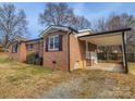 A spacious carport area compliments the brick exterior of this well maintained home at 1007 Little John Trl, Kannapolis, NC 28081