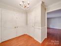 Elegant foyer featuring hardwood floors, chandelier, and closet for storage at 1200 Berkshire Dr, Kannapolis, NC 28081