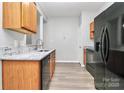 Functional kitchen with stainless steel appliances, light wood cabinetry, and stylish countertop at 1765 Holliford Ct, Charlotte, NC 28215