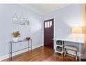 Light and airy entryway with hardwood floors and a stylish console table at 1921 Kenilworth Ave, Charlotte, NC 28203