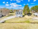 Charming two-story home with dormer windows, a long driveway, and lush landscaping from above at 2927 Forest Hills Cir, Rock Hill, SC 29732