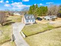 Charming two-story home with dormer windows, a long driveway, and lush landscaping from above at 2927 Forest Hills Cir, Rock Hill, SC 29732