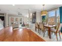 Bright living and dining area with hardwood floors, large windows, and stylish decor at 351 W 7Th St, Charlotte, NC 28202