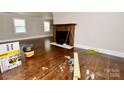 View of the living room with hardwood floors and a fireplace, offering a cozy and inviting atmosphere at 506 E Ridge St, Kings Mountain, NC 28086