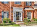 Inviting front entrance with a decorative door, sidelights, and manicured landscaping at 550 S Portman Ln, Fort Mill, SC 29708