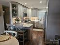 Well-appointed kitchen with an island, bar stool seating, and ample cabinet space at 9709 Emerald Point Dr # 2, Charlotte, NC 28278
